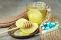 Cup of tea with lemon, pills, a thermometer and a warm scarf. vitamin tea. cold and flu remedy. Royalty Free Stock Photo