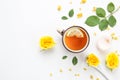 Cup of tea with lemon, rose flowers and leaves. top view, free space for text Royalty Free Stock Photo