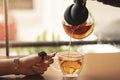 Cup of tea with lemon on table close-up and hand Royalty Free Stock Photo