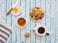 Cup of tea with lemon, a teapot and dried fruits on a wooden table Royalty Free Stock Photo