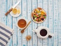 Cup of tea with lemon, a teapot and dried fruits on a wooden table Royalty Free Stock Photo