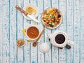 Cup of tea with lemon, a teapot and dried fruits on a wooden table Royalty Free Stock Photo