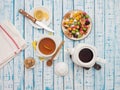 Cup of tea with lemon, a teapot and dried fruits on a wooden table Royalty Free Stock Photo