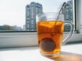 cup of tea with lemon on a white window sill