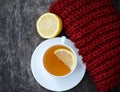 Cup of tea with lemon on a wooden surface