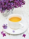 Cup of tea and lilac flowers Royalty Free Stock Photo