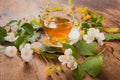 Cup of tea linden jasmine on wooden background