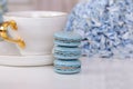 Cup of tea, macaroons and blue hydrangea Royalty Free Stock Photo