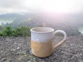 Cup of tea in the mountains. Relax on vacation with morning hot coffee or tea with nature view. Royalty Free Stock Photo