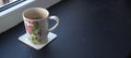 A cup with tea near the window Royalty Free Stock Photo