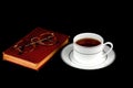 Cup of Tea with Old Book and Spectacles on Black Royalty Free Stock Photo
