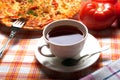 Cup of tea and pizza Royalty Free Stock Photo