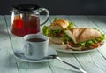 Cup of tea, plate with sandwiches and teapot Royalty Free Stock Photo