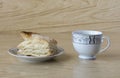 Cup of tea and a puff pastry Royalty Free Stock Photo