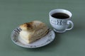 Cup of tea and a puff pastry Royalty Free Stock Photo