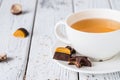 Cup of tea with raw handmade chocolate candies on white wooden table Royalty Free Stock Photo