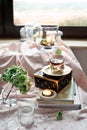 Cup of tea in a romantic room settings with candles and flowers Royalty Free Stock Photo