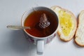 Cup of tea and sandwiches with butter and goosberry Jam