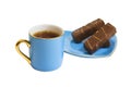 Cup with tea and a saucer with sweets Royalty Free Stock Photo