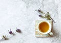 Cup of Tea and Sea Holly Flowers on gray stone background Royalty Free Stock Photo