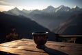 A cup of tea sitting on a table with a view of theMountain in the background. Generative AI Royalty Free Stock Photo