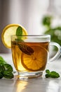 A cup of tea with a slice of lemon and a sprig of mint Royalty Free Stock Photo