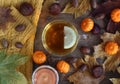 A cup of tea with a slice of lemon. Transparent cup of green tea on a wooden background.