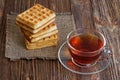 Cup of tea and stack of waffles