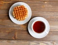 Cup of tea and stack of waffles