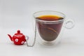 Cup of tea with tea strainer isolated on white background Royalty Free Stock Photo