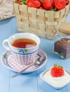 A cup of tea with a strawberry-yogurt dessert Royalty Free Stock Photo