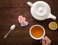 Cup tea teapot cookies on wooden background Royalty Free Stock Photo