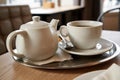 Cup of tea and a teapot inside a cafe Royalty Free Stock Photo