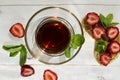 Cup of tea and toast with peanut butter and strawberries