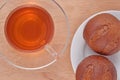 Cup of tea and two fresh buns Royalty Free Stock Photo