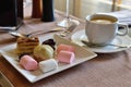 A cup of tea and various sweets Royalty Free Stock Photo