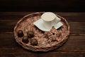 A cup of tea on a wicker tray. Chocolates Royalty Free Stock Photo