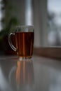 Cup of tea on windowsill in blurred background