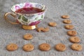 Cup of tea witn round crackers on linen Royalty Free Stock Photo