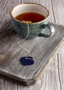 Cup of tea on a wooden Board, a craft village, tea bag Royalty Free Stock Photo