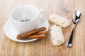 Cup with teabag, cinnamon on saucer, glazed cookies with fruit Royalty Free Stock Photo