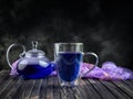Cup and teapot butterfly pea flower blue tea. Healthy detox herbal drink Royalty Free Stock Photo