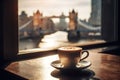Cup of coffee with London view on background with sunset, selective focus.