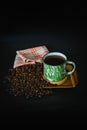 a cup of traditional Indonesian coffee with black background copy space