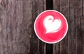 Cup of trendy beetroot latte on table. Royalty Free Stock Photo