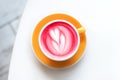 Cup of trendy beetroot latte on table. Royalty Free Stock Photo