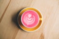 Cup of trendy beetroot latte on table. Royalty Free Stock Photo