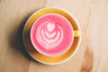 Cup of trendy beetroot latte on table. Royalty Free Stock Photo