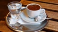 Cup of Turkish coffee with glass of water. Royalty Free Stock Photo