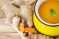 a cup of Turmeric Tea with lemon and ginger , Benefits for reduce Inflammation , Liver Detox and Cleanser healthy herb drink Royalty Free Stock Photo